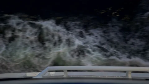 Looking down at the water from a moving passenger ferry ship deck Stock Footage 152419784
