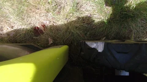 Looking downward on a lawn mower while it mows grass 스톡 동영상 312767478