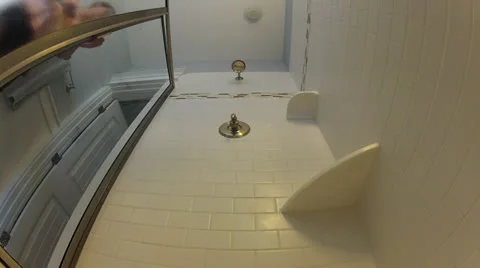 Looking up from drain at shower turning on, realtime Stock Footage 25996667