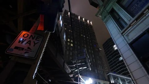 Looking Up At El Train As passes above. Nighttime in Chicago Stock Footage 166812863