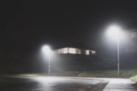 Looking up at an empty office building on a misty winters night. Stock Photos