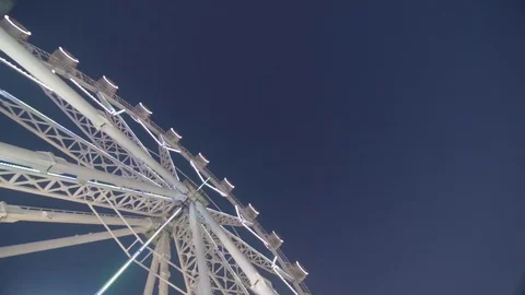 Looking up at ferris wheel in the evening Stockbeeldmateriaal 83538173