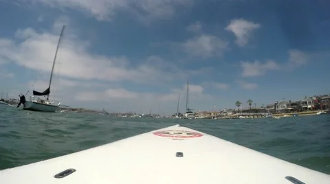 Looking forward from standup paddle board in mooring field by Balboa Island C Stock Footage 67580369