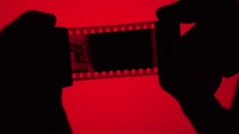 Looking At Frames Of 35mm Film original Stock Footage 266158148