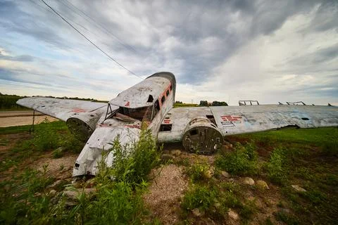 Looking at front of crashed airplane in fields of America Stock Photos