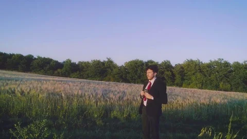 Looking to the future. Young businessman with binoculars in the middle of the Stock Footage