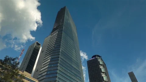 Looking up at glass skyscraper Stock Footage 124061759