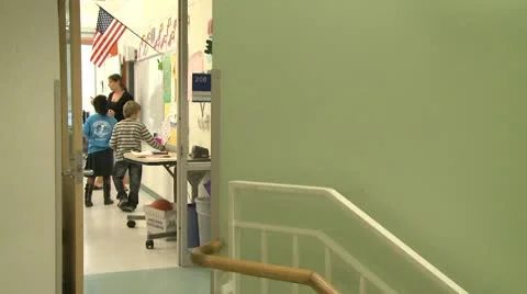 Looking into Grammar school classroom from hallway Stock Footage 8979403
