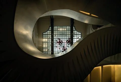 Looking up of The grand helical staircase featuring graceful curves and int.. Stock Photos