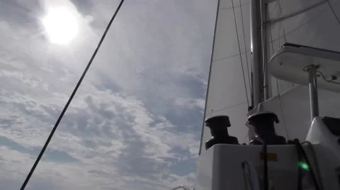 Looking from helm two winch drums in view with head and main sail Stock Footage 67956388