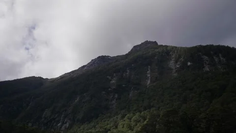Looking up at high mountain above Vídeos de archivo 327764509