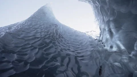 Looking up in an ice cave formation of a melting glacier Stock Footage 260599538