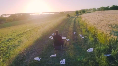 Looking for idea. Young businessman with computer in the middle of the nature Stock Footage 76685404