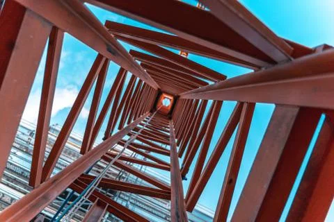 Looking up inside a construction crane from the ground. Stock Photos