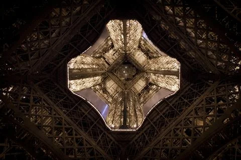 Looking up inside the Eiffel Tower in Paris, France. Stock Photos