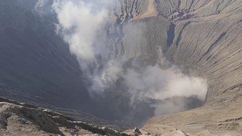 Looking inside smoking crater of volcano in Bromo Java Indonesia Stock Footage 84069591