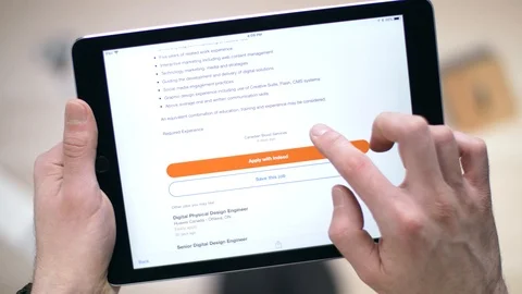 Looking at Job Offers on a Tablet Device Stock Footage 88342469