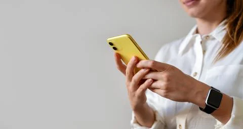 Looking for a job online using a mobile phone. Female businessperson woman ex Stock Photos