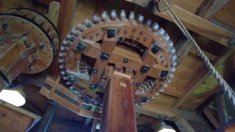Looking Up At Large Spinning Wooden Cogs Inside Windmill Video stock 171870328