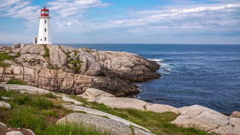 Looking at lighthouse in Peggy's Cove, Nova Scotia, Canada Stock Photos