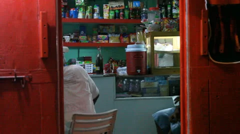 Looking in local storefront in Dominica Stock Footage 25510503