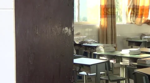Looking into the messy empty classroom through the door in a high school Stock Footage 45192836
