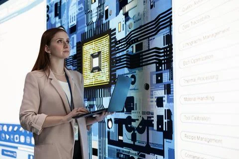 Looking at microchip, digital circuit board and female engineer Stock Photos