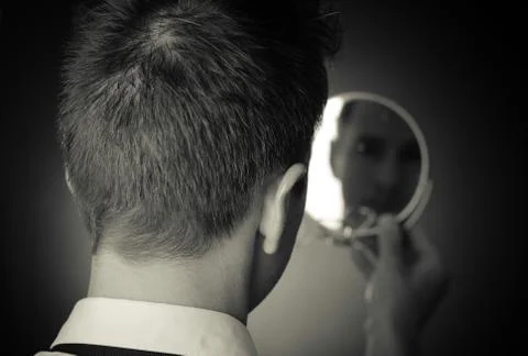 Looking in the mirror and reflecting Stock-Fotos