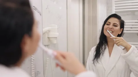 Looking at mirror, Bathrobe Lady, Teeth Brushing Stock-Footage 306319478