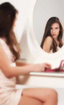 Looking in the mirror. Stock Photos