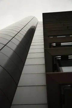 Looking up at a modern office building Stock Photos
