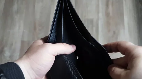 Looking for money in an empty purse Stock Footage 108160526