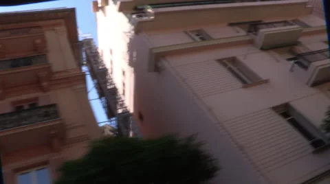 Looking up at Monte Carlo buildings from open top bus Stock Footage 48176635