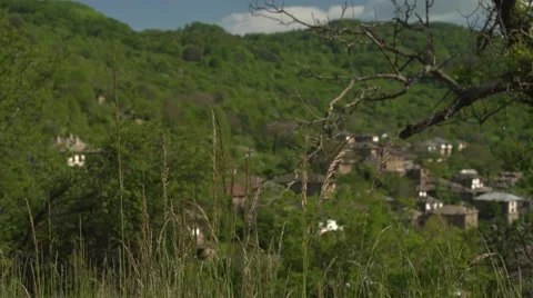 Looking at the Mountain Village Through the Trees Focus 4K Video stock 63918057