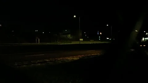 Looking at night traffic passing vehicles alone lost scared concept in Stock Footage 125816255