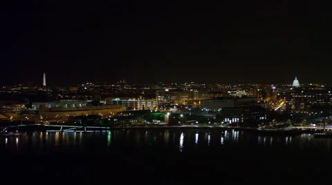 Looking north from above the Potomac River at night, Washington Monument and Stock Footage 59198159