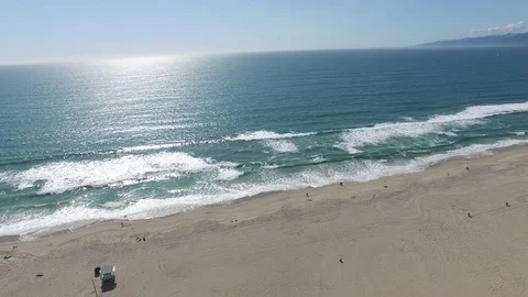 Looking at ocean high to low end at vollyball courts Video stock 76139158