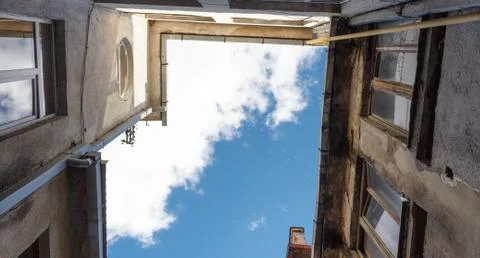 Looking up at old building to sky in perspective view Stock Photos