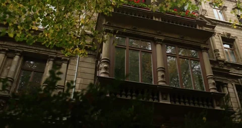 Looking at a old german stone mansion like building in residential area Stock Footage 230489040