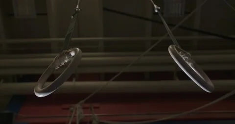 Looking up at Olympic Rings in gym dramatically lit Stock Footage 132207649