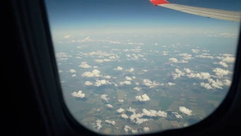 Looking Out From Airplane Window. Dolly shot through airplane window Stock Footage