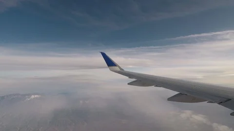 Looking out an airplane window during a flight. Timelapse. Stock Footage 115961689
