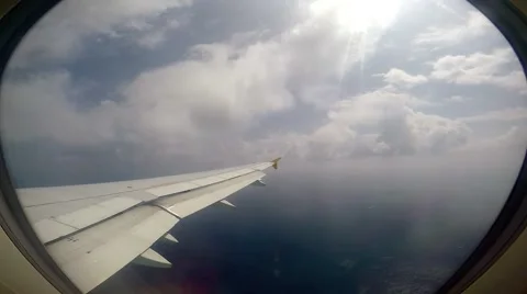 Looking Out of an Airplane Window on the engine and wing Stock Footage 51980598