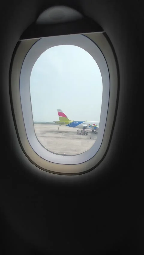 Looking Out the Airplane Window, A plane and cloudy weather Stock Footage 276966284
