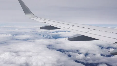 Looking out of airplane window at the sky Stock Footage 87986144