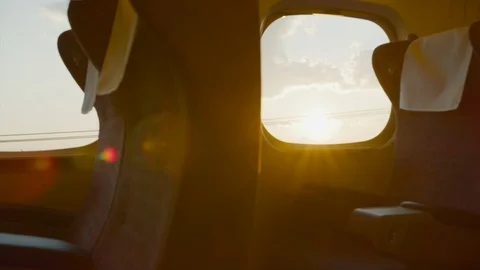 Looking out of a bullet train window at sunset clouds. Travel and tourism. Stock Footage 125720327