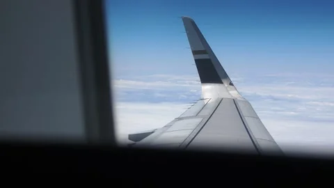 Looking out a cabin window at a wing in smooth flight. Stock Footage 345355822