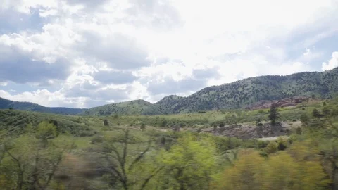 Looking Out a Car Window on a Road Trip Through the Rocky Mountains Stock Footage 109131274