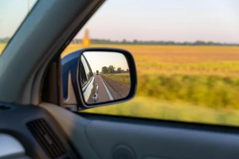 Looking out of the car window while traveling near rural farmland in the south Stock Photos