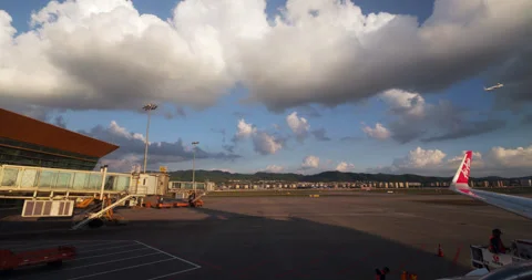 Looking out to clouds and airplane taking off from other plane 動画素材 329627321